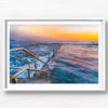 Long exposure photo of Wylies Baths ocean rockpool during sunrise at Coogee