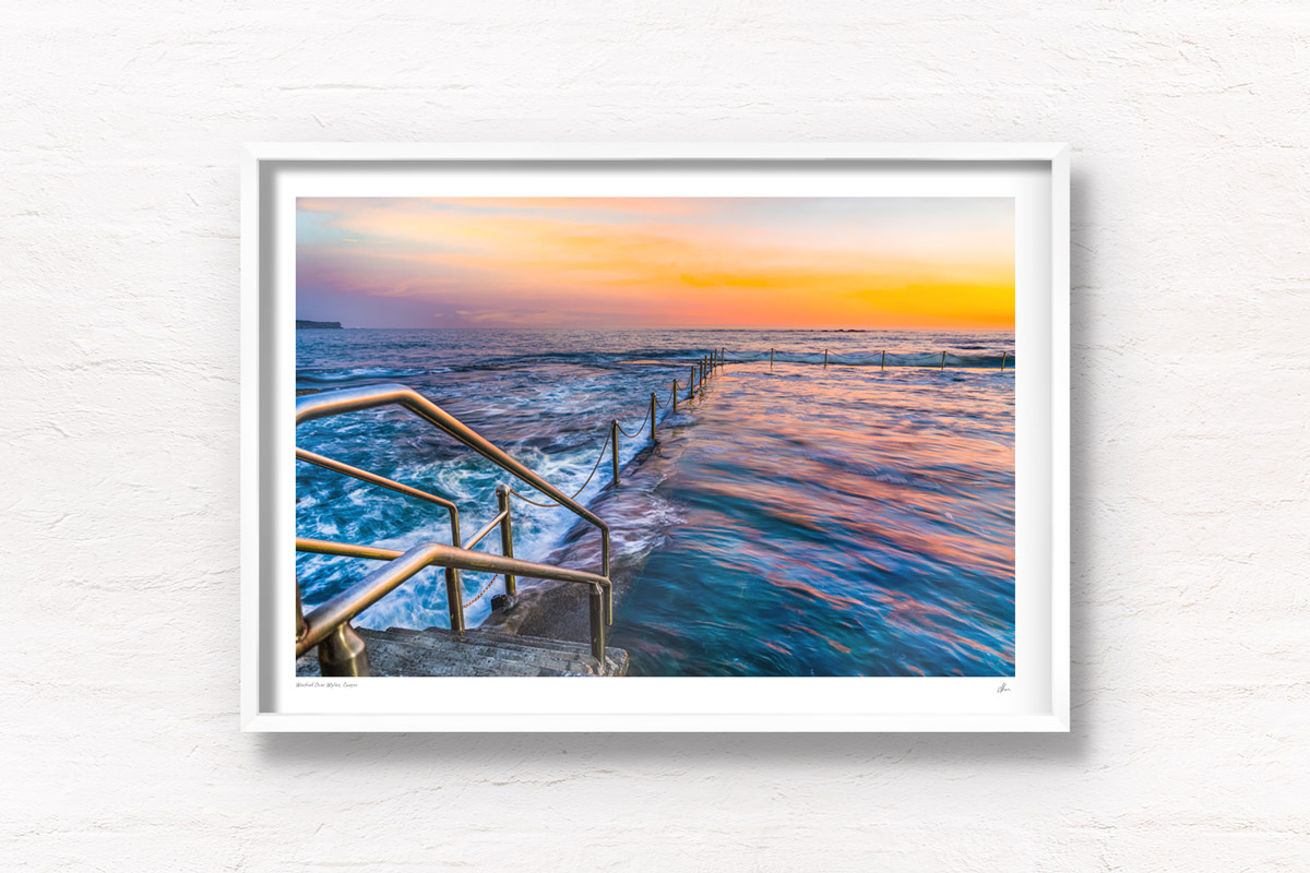 Long exposure photo of Wylies Baths ocean rockpool during sunrise at Coogee