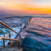 Long exposure photo of Wylies Baths ocean rockpool during sunrise at Coogee