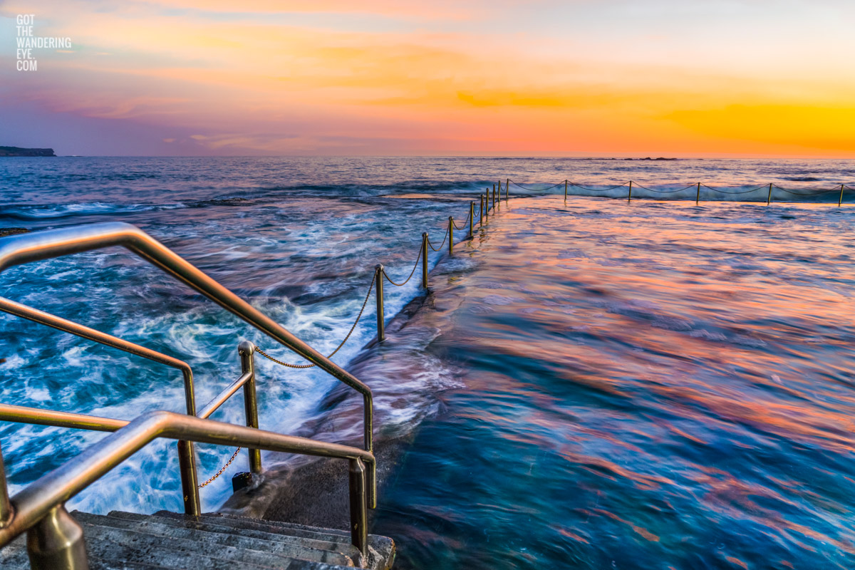 Long exposure photo of Wylies Baths ocean rockpool during sunrise at Coogee