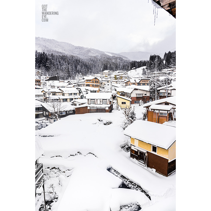 Snowy mountain village. Nozawa Onsen, Japan buried under snow.