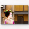 Portrait photo of a Maiko (apprentice Geisha) walking the streets of Gion, Kyoto Japan