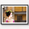 Portrait photo of a Maiko (apprentice Geisha) walking the streets of Gion, Kyoto Japan