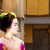 Portrait photo of a Maiko (apprentice Geisha) walking the streets of Gion, Kyoto Japan