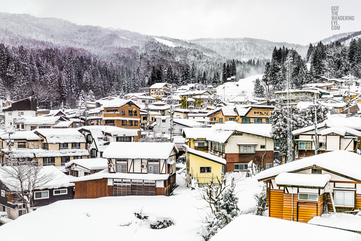 Snowy mountain village. Nozawa Onsen, Japan buried under snow.