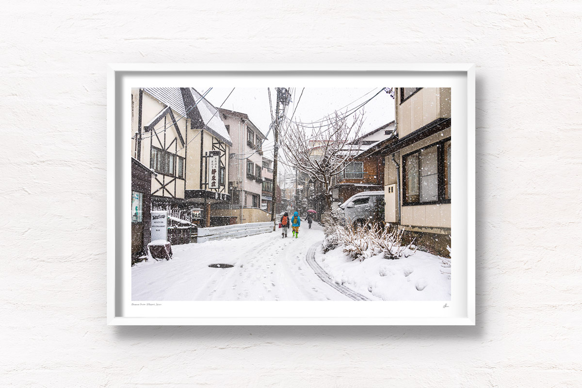 Local villagers walking around Nozawa Onsen village in Japan during snowfall in winter