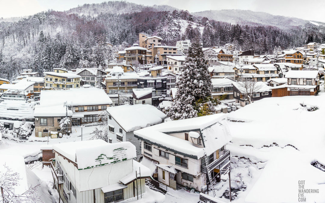 Snowy mountain village. Nozawa Onsen, Japan buried under snow.