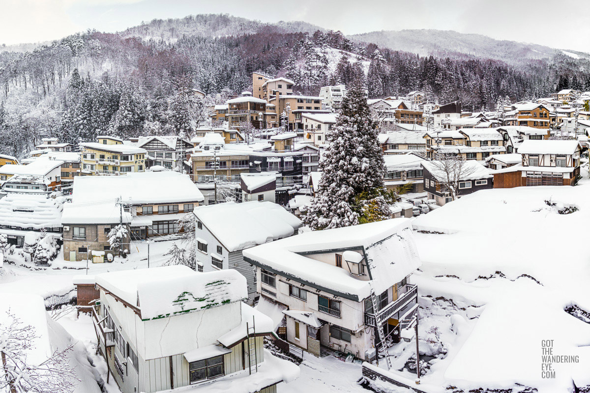 Snowy mountain village. Nozawa Onsen, Japan buried under snow.