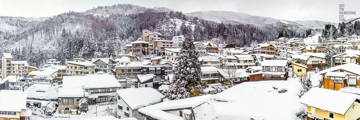 Snowy mountain village. Nozawa Onsen, Japan buried under snow.