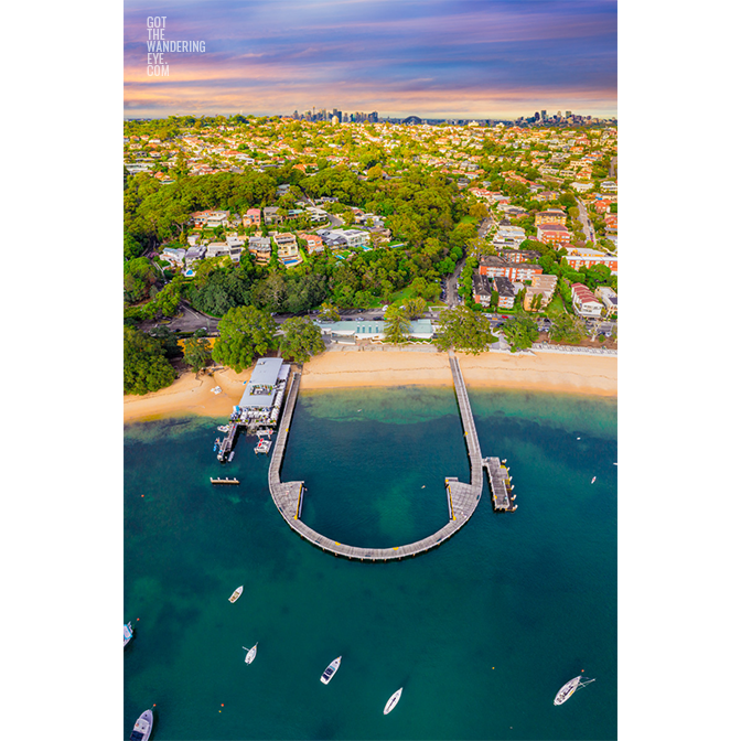 Aerial seascape above Balmoral Beach with the Sydney skyline in the horizon