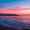 Aerial seascape of a gorgeous pink sky sunrise over Ben Buckler Bondi Beach
