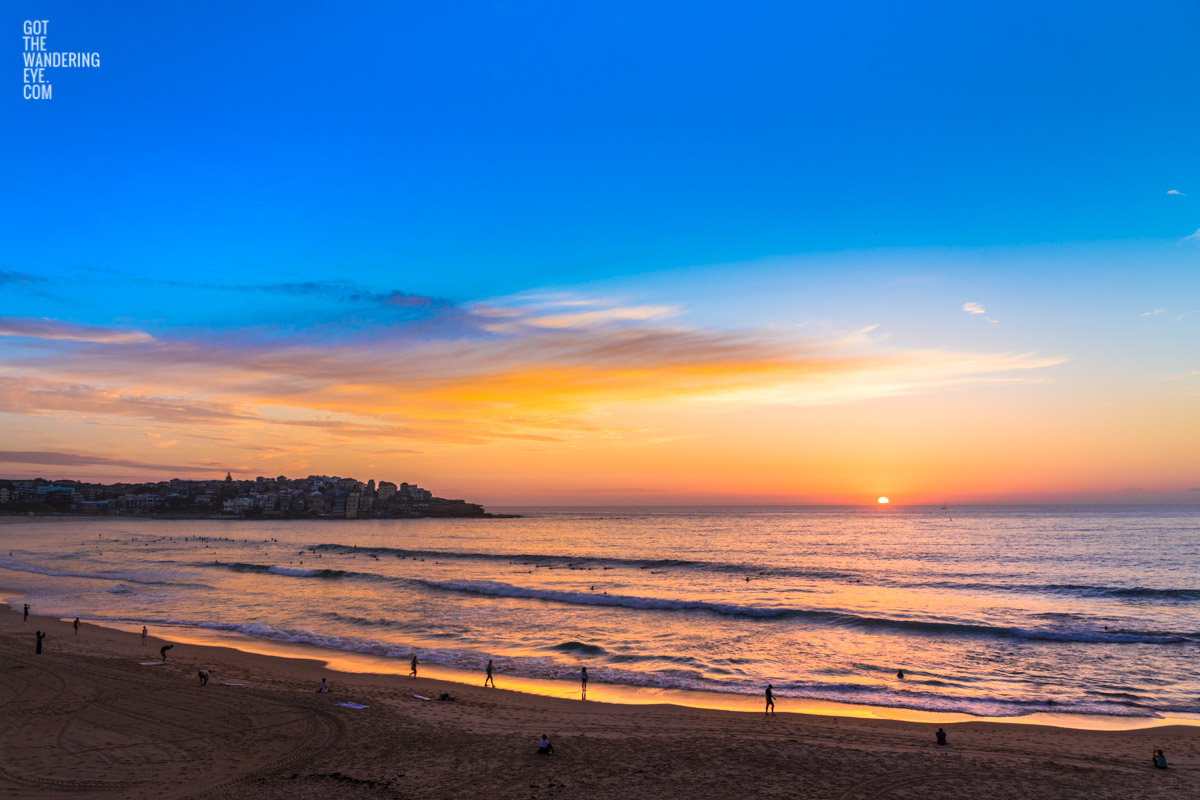 Locals stop and stare at a gorgeous sunrise over Bondi Beach