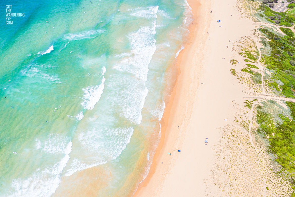 Aerial seascape above Curl Curl Beach on a hot Summers day. Northern Beaches.