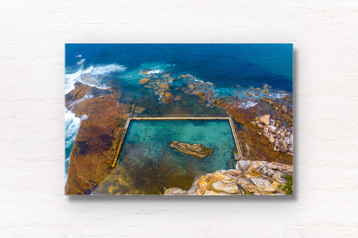 Aerial seascape above an empty North Curl Curl rockpool in the northern beaches