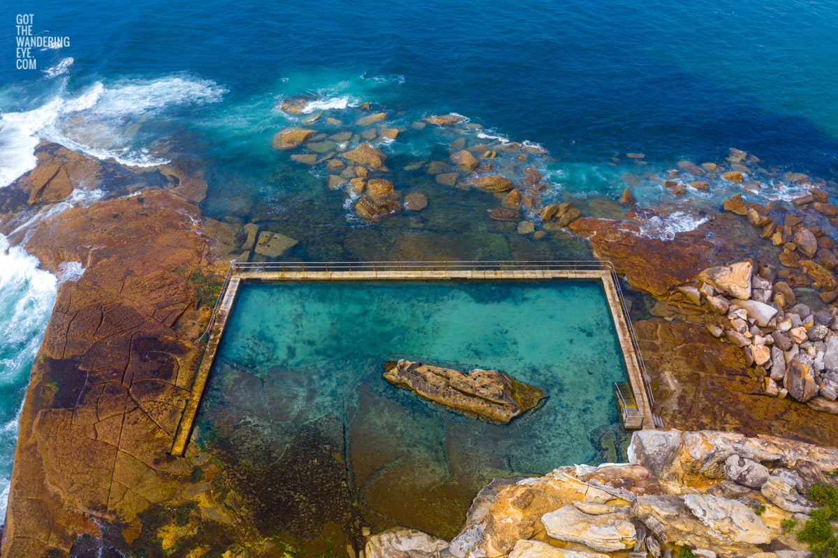 Aerial seascape above an empty North Curl Curl rockpool in the northern beaches