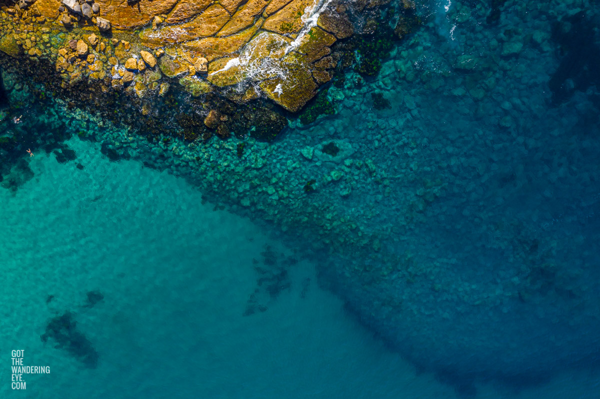 Aerial seascape above swimmers enjoying Flat Rock North Bondi