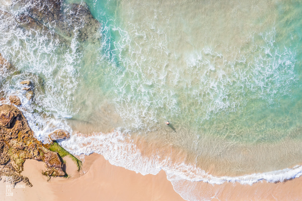 Aerial seascape above crystal clear waters of North Maroubra Beach