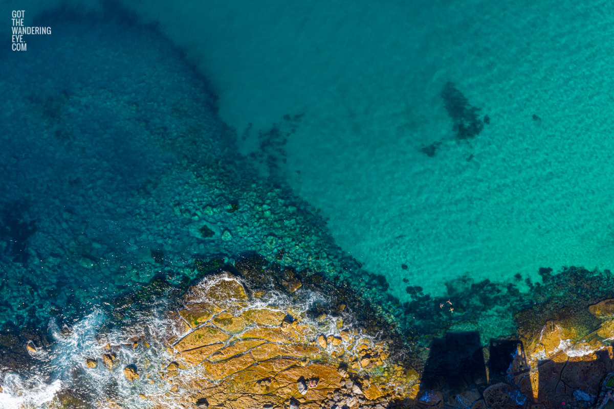 Aerial seascape above swimmers enjoying Flat Rock North Bondi