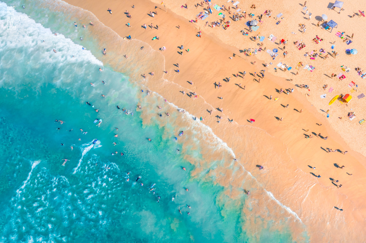 Aerial seascape above a packed Bondi Beach on a gorgeous Summers Day.