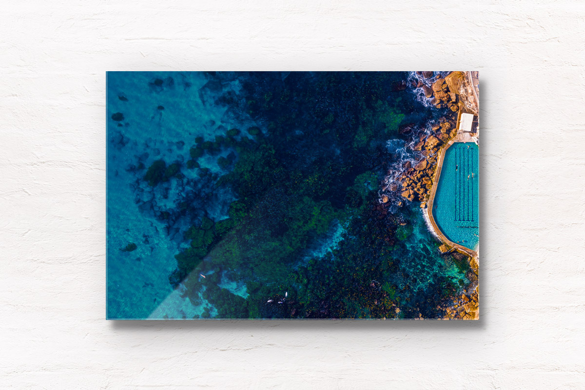 Aerial seascape above the blue waters of Bronte Beach Rockpool.