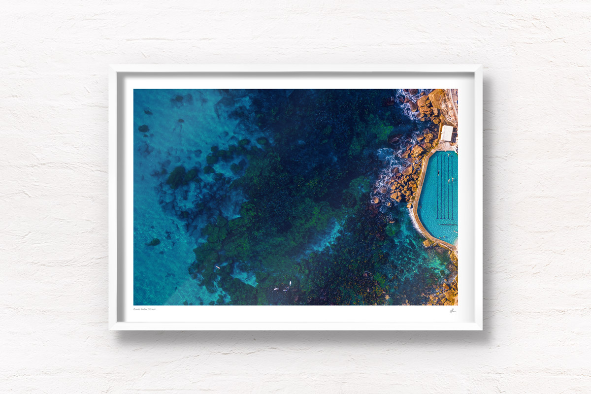 Aerial seascape above the blue waters of Bronte Beach Rockpool.