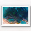 Aerial seascape above the blue waters of Bronte Beach Rockpool.