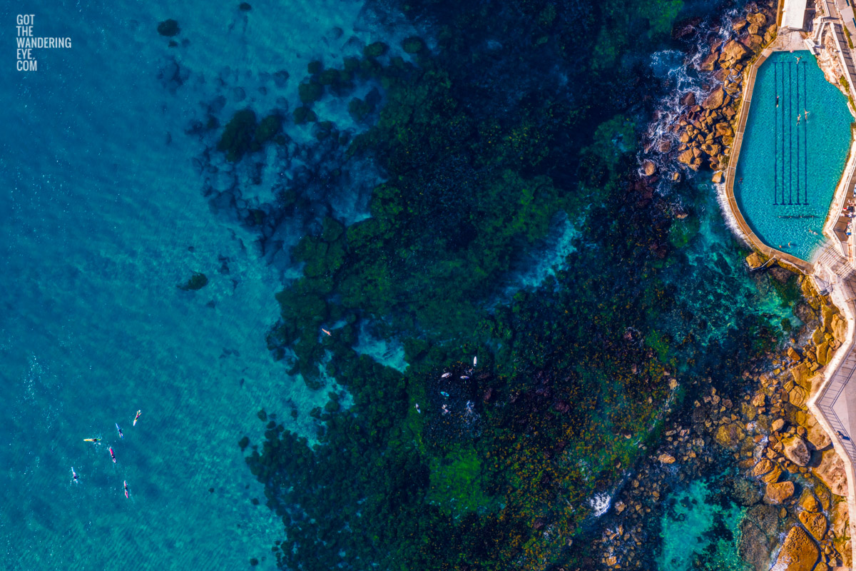 Aerial seascape above the blue waters of Bronte Beach Rockpool.