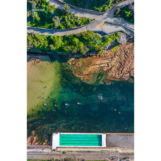 Aerial seascape above swimmers enjoying Clovelly Beach on a Summers day. Clovelly Ocean Pool.