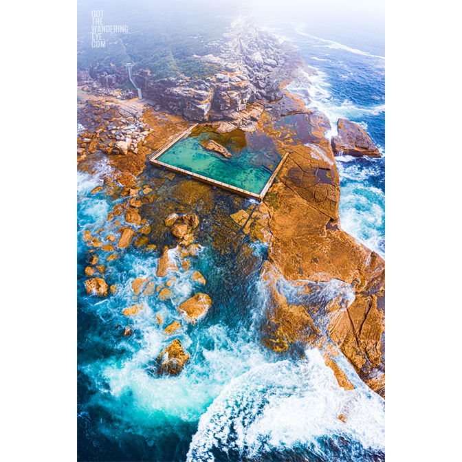 Aerial seascape on a misty morning at North Curl Curl Rockpool. Northern Beaches Rockpool