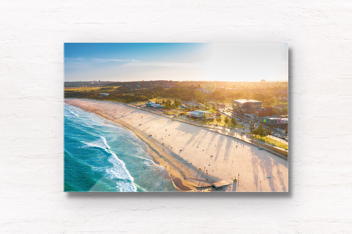 Aerial shot of a gorgeous golden sunset creating long soft shadows over Maroubra Beach, Sydney