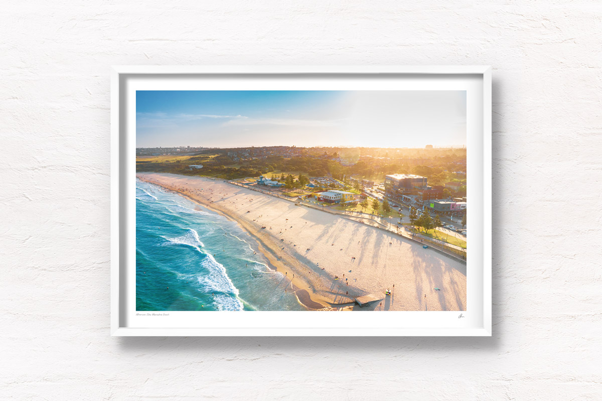 Aerial shot of a gorgeous golden sunset creating long soft shadows over Maroubra Beach, Sydney