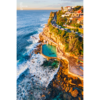 Aerial seascape of Bronte Rockpool bathed in a warm glow from the sunrise during Winter.