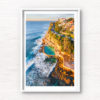 Aerial seascape of Bronte Rockpool bathed in a warm glow from the sunrise during Winter.