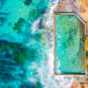 Aerial oceanscape above crystal clear waters of South Cronulla Beach Rockpool