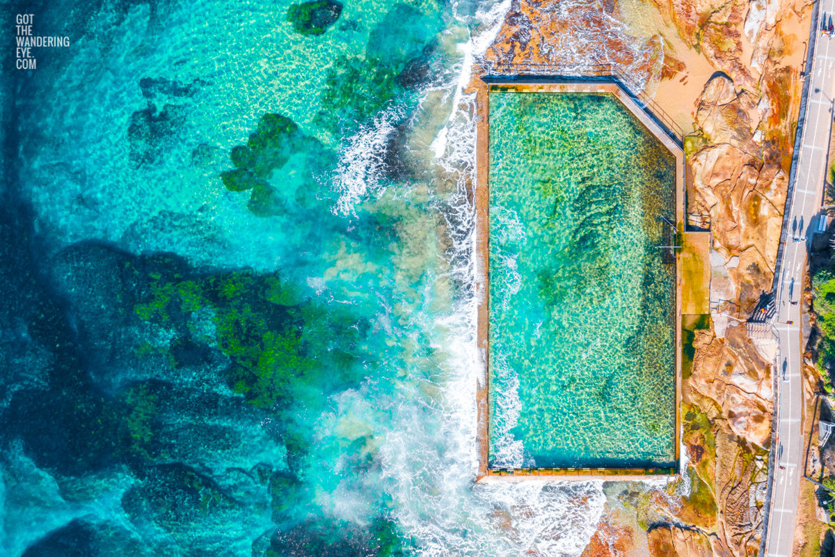 Aerial oceanscape above crystal clear waters of South Cronulla Beach Rockpool