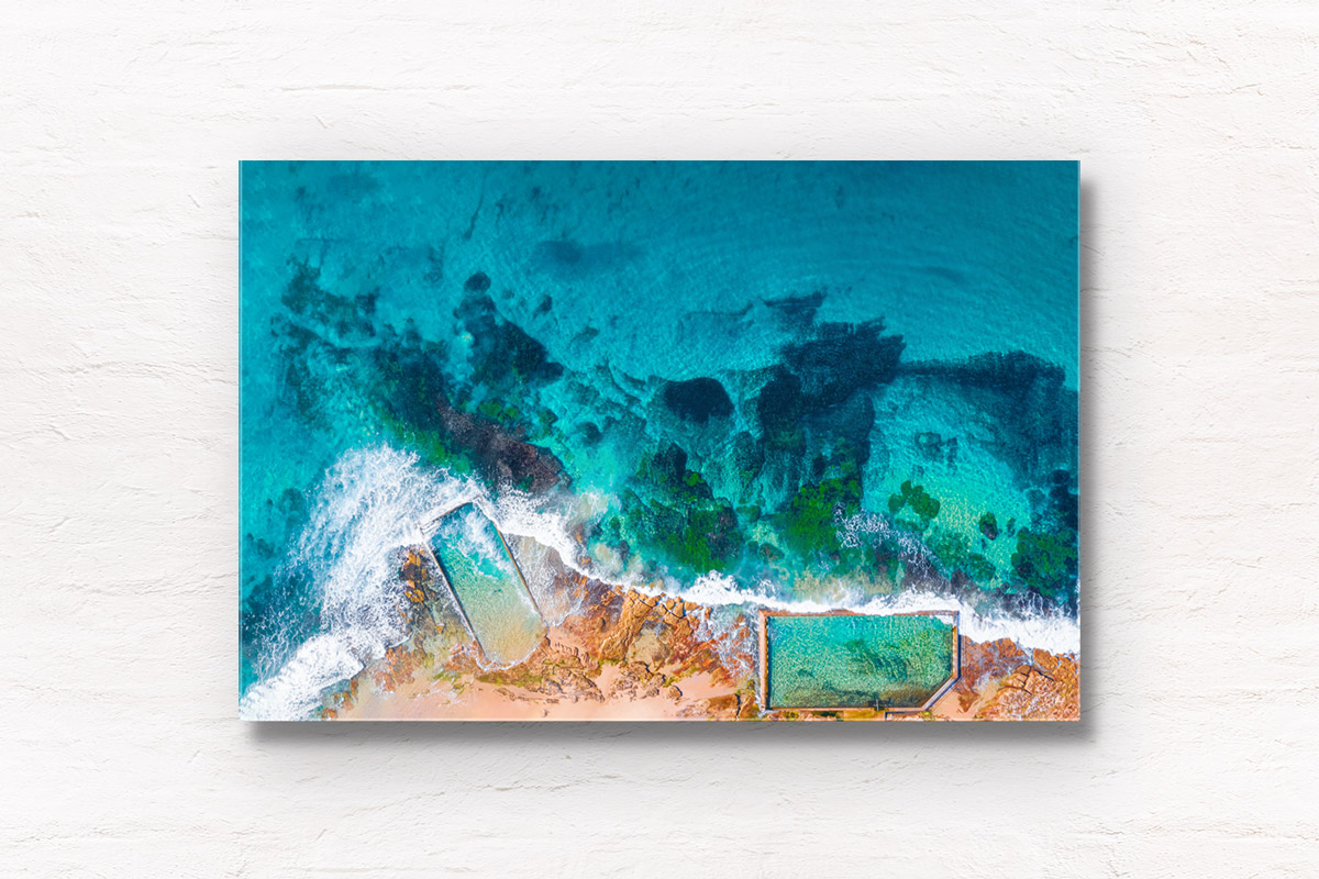 Aerial oceanscape above crystal clear waters of Cronulla Beach Rockpools