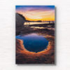 Fiery purple sky sunrise in a puddle of water at Mahon Pool, Maroubra