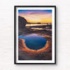Fiery purple sky sunrise in a puddle of water at Mahon Pool, Maroubra