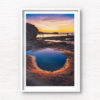 Fiery purple sky sunrise in a puddle of water at Mahon Pool, Maroubra