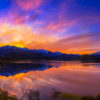 Stunning silky pink sunset sky with reflection of mountains of Wanaka New Zealand