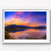 Stunning silky pink sunset sky with reflection of mountains of Wanaka New Zealand