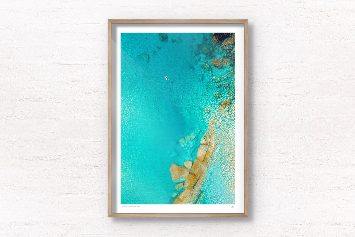 Aerial oceanscape above turquoise crystal clear waters of South Cronulla Beach.