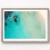 Aerial oceanscape above secluded crystal clear ocean beach waters of South Cronulla Beach