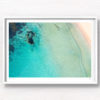 Aerial oceanscape above secluded crystal clear ocean beach waters of South Cronulla Beach
