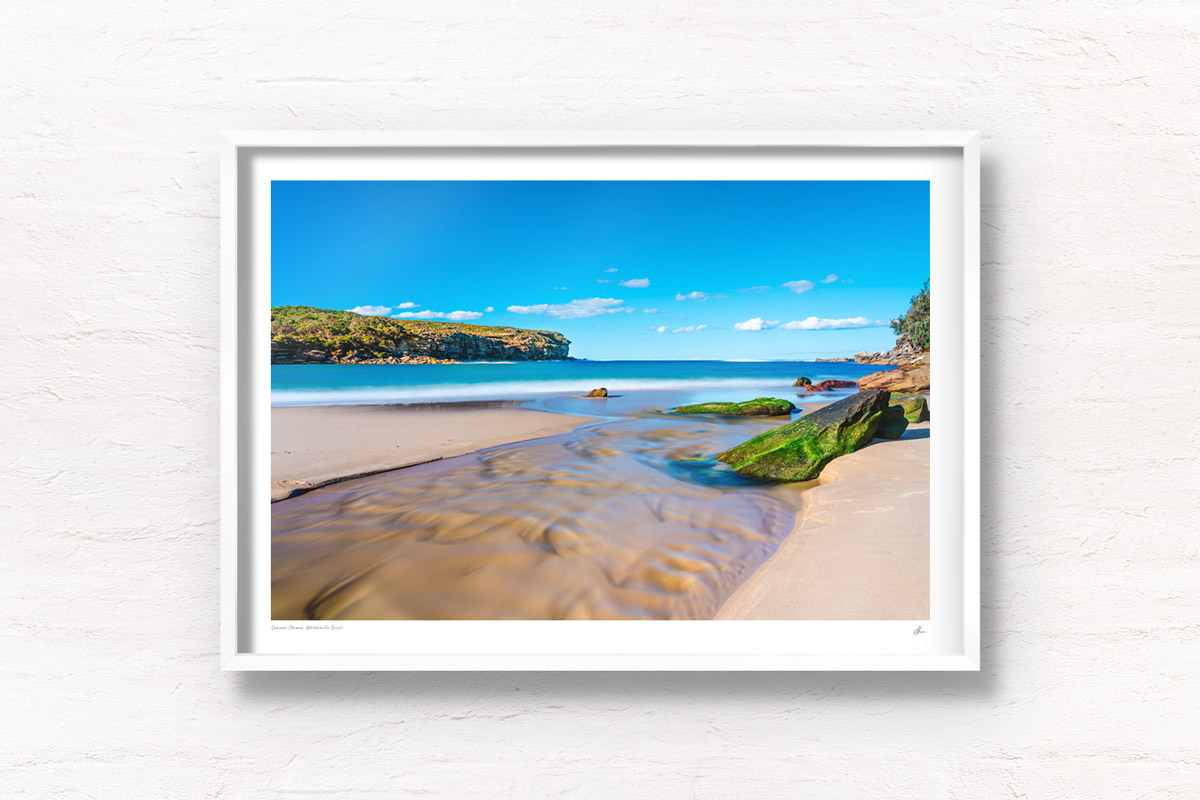 Framed fine art print of a beautiful long exposure photography of Wattamolla Beach, with waterfall stream flowing into beach, ocean. Royal National Park