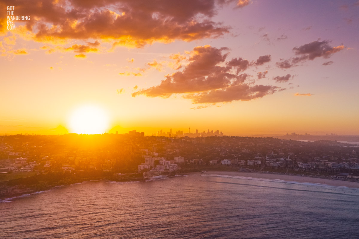 Aerial view of a gorgeous sunset over the Sydney skyline from Bondi Beach. beach, ocean, sunset