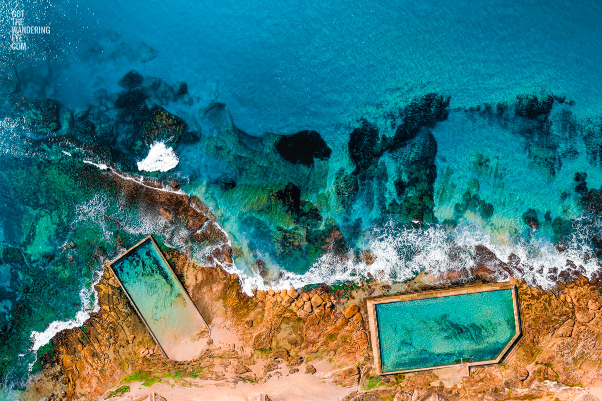 Aerial oceanscape above ocean rockpools Cronulla Beach. Turquoise ocean beach waters rockpool Sydney