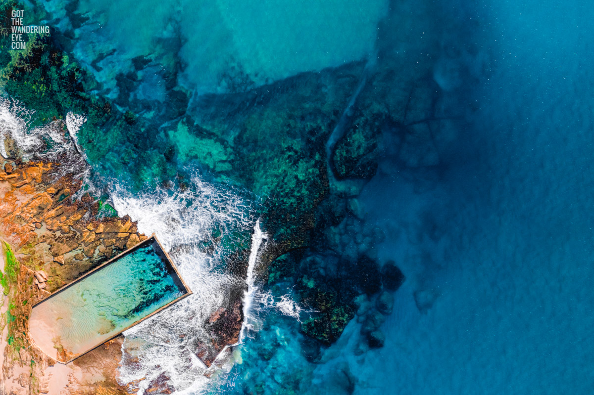 Aerial oceanscape above the gorgeous blue waters of North Cronulla ocean, rockpool. Surrounded by beautful coloured waters like the greek island of Corfu.