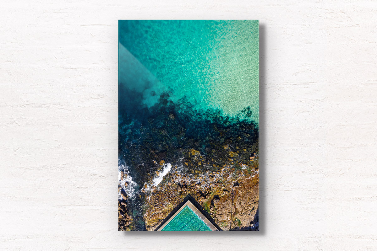 Fine art framed print of a aerial oceanscape above crystal clear waters of Freshwater Beach. Ocean, rockpool summertime.