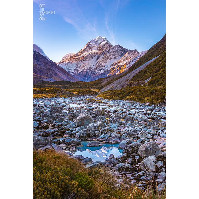 Sunkissed Mount Cook puddle lake reflection in Hooker Valley, New Zealand